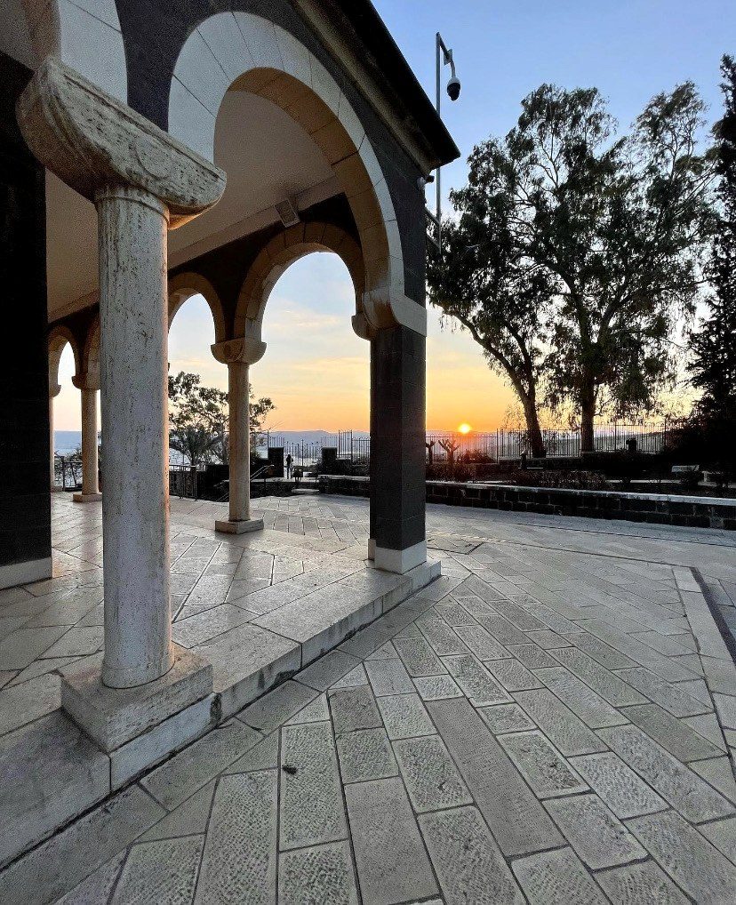 Stone arches at sunset on the Mount of Beatitudes above the Sea of Galilee